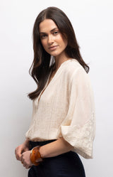 Ivory lightweight voile blouse with tonal embroidered sleeves, flattering V-neck and relaxed fit – Volange Paris, Parisian fashion in Sydney (Mosman, Paddington and Bronte) or Australia-wide online.