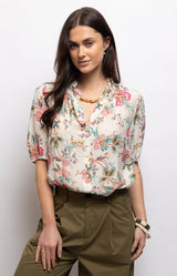Ivory floral blouse with a colourful print, ruffled neckline, neck ties and puff sleeves – Volange Paris, Parisian fashion in Sydney (Mosman, Paddington and Bronte) or Australia-wide online.