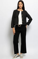 Black cropped jacket with subtle shimmer and gold buttons, timeless Parisian chic – French fashion from Volange Paris.