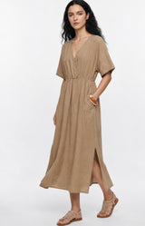 Effortlessly chic camel dress in 100% cotton with a flattering V-neck, elasticated waist and flowing silhouette. Discover Volange Paris, Parisian fashion in Sydney (Mosman, Paddington and Bronte) or Australia-wide online.