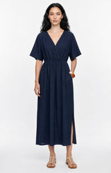 Effortlessly chic navy dress in 100% cotton with a flattering V-neck, elasticated waist and flowing silhouette. Discover Volange Paris, Parisian fashion in Sydney (Mosman, Paddington and Bronte) or Australia-wide online.
