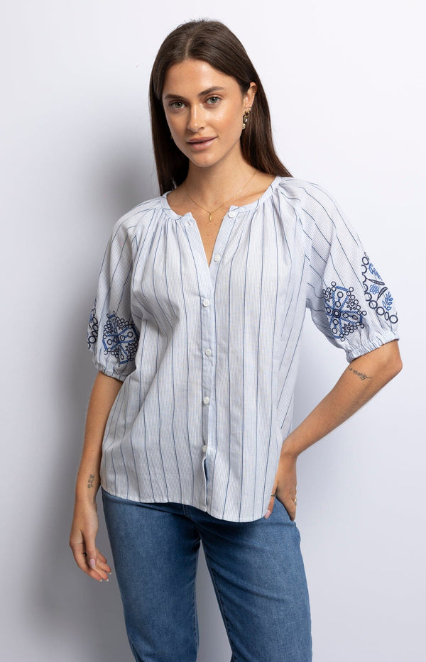 Refined cotton blouse in light blue with embroideries on the sleeves – French fashion elegance from Volange Paris