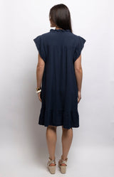 Navy cotton dress with textured waffle fabric, a ruffled neckline, flutter sleeves and flounced hem – Volange Paris, Parisian fashion in Sydney (Mosman, Paddington and Bronte) or Australia-wide online.