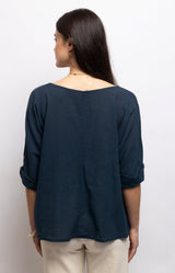 Navy linen cotton top with a relaxed oversized fit, soft boat neckline and rolled sleeves for effortless everyday style – Volange Paris, Parisian fashion in Sydney (Mosman, Paddington and Bronte) or Australia-wide online.