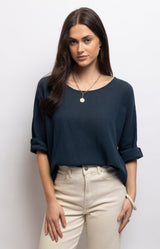 Navy linen cotton top with a relaxed oversized fit, soft boat neckline and rolled sleeves for effortless everyday style – Volange Paris, Parisian fashion in Sydney (Mosman, Paddington and Bronte) or Australia-wide online.