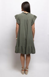Olive cotton dress with textured waffle fabric, a ruffled neckline, flutter sleeves and flounced hem – Volange Paris, Parisian fashion in Sydney (Mosman, Paddington and Bronte) or Australia-wide online.