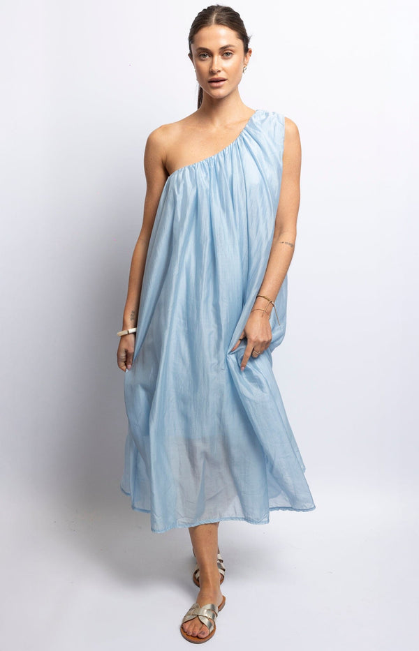 One-shoulder sky blue midi dress with soft flowy silhouette — Parisian summer fashion by Volange Paris.