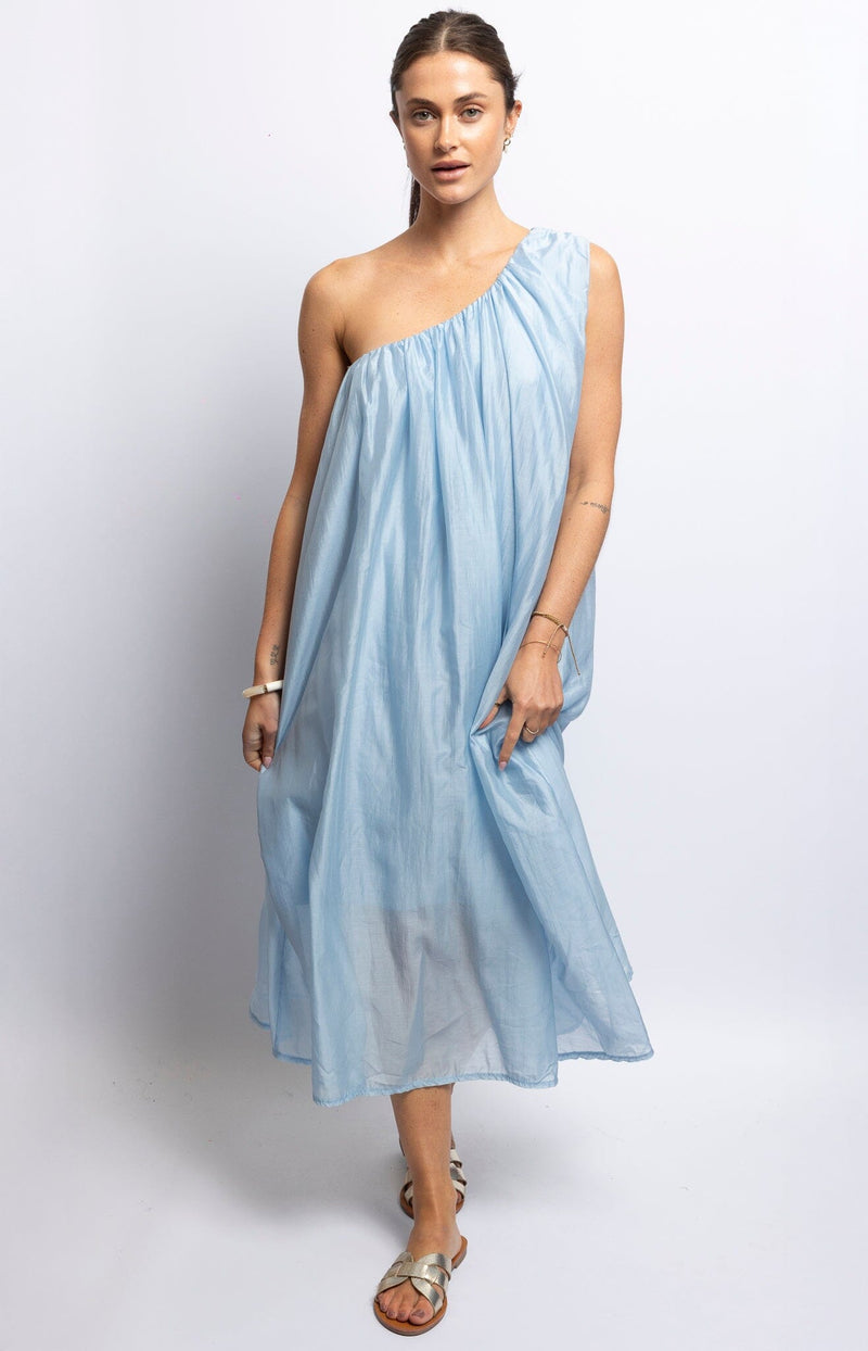 One-shoulder sky blue midi dress with soft flowy silhouette — Parisian summer fashion by Volange Paris.