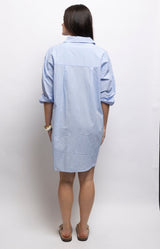 Pale blue cotton shirt dress with a relaxed fit, button-down front, side pockets and curved hem. 100% cotton – Volange Paris, Parisian fashion in Sydney (Mosman, Paddington and Bronte) or Australia-wide online.