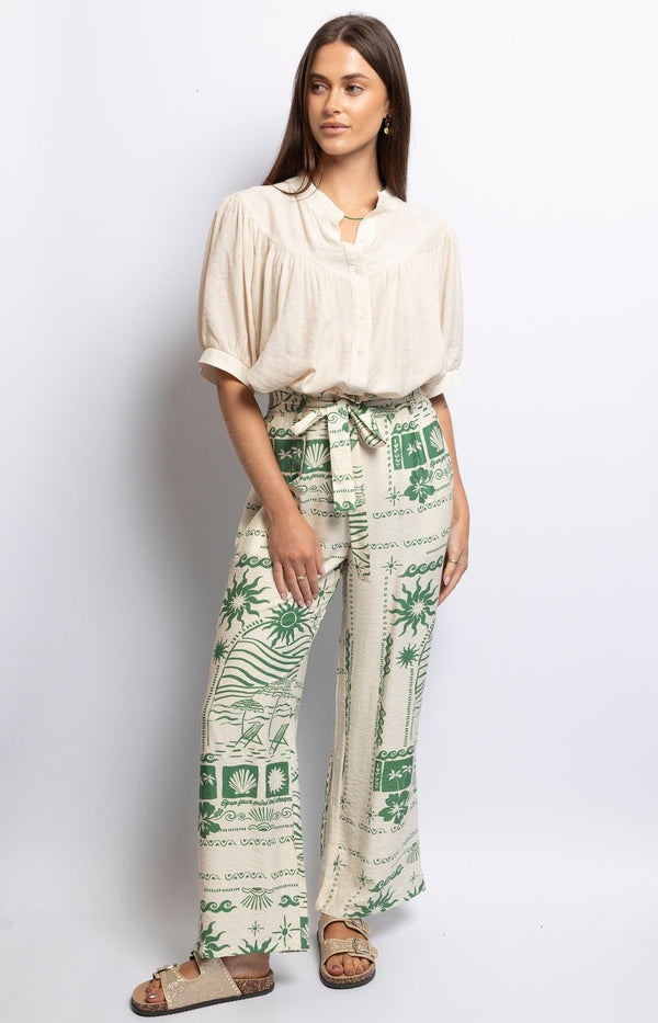 Printed green and beige wide-leg pants with paperbag waist and tie belt, lightweight summer style – Parisian fashion by Volange Paris.