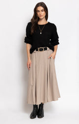 Beige pinstripe midi skirt with a flowing A-line silhouette, elasticated waistband and elegant drape for effortless everyday dressing – Volange Paris, Parisian fashion in Sydney (Mosman, Paddington and Bronte) or Australia-wide online.