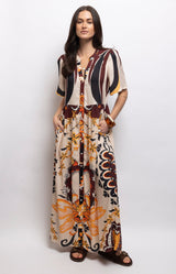 Printed maxi dress in cream, burgundy, black and gold tones, with a V-neckline, button-down front, gathered waist and side pockets – Volange Paris, Parisian fashion in Sydney (Mosman, Paddington and Bronte) or Australia-wide online.