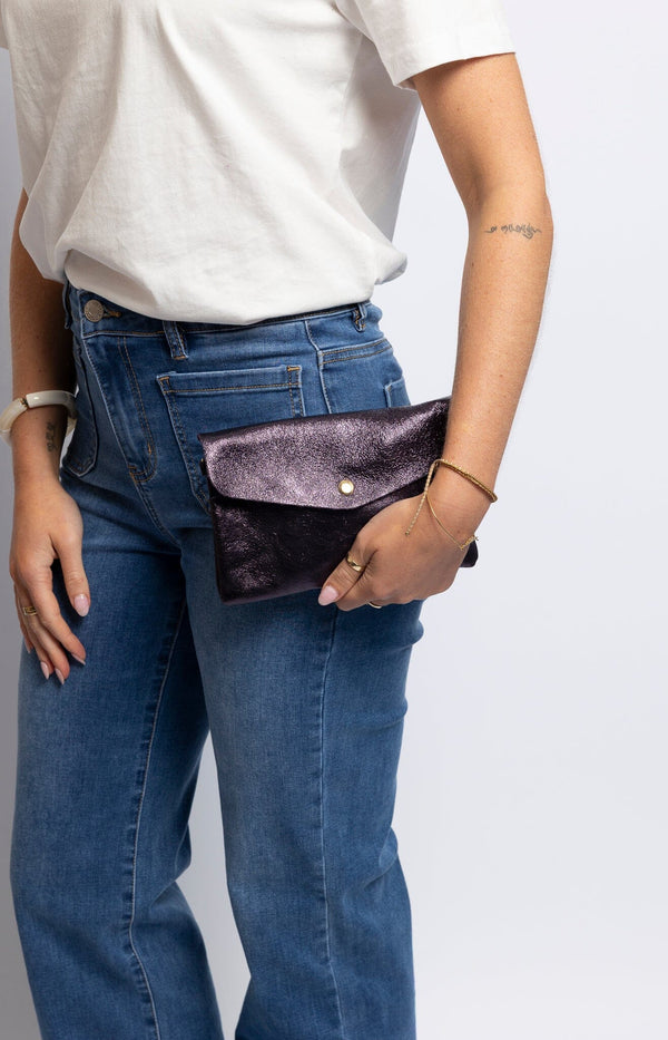Compact shimmering purple metallic leather crossbody with gold snap and adjustable strap – Effortless Parisian glamour by Volange Paris.