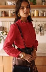 Red cotton blouse with lace sleeve detailing and ruffle neckline – Volange Paris, Parisian fashion in Sydney (Mosman, Paddington and Bronte) or Australia-wide online.
