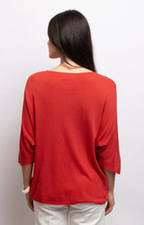 Red lightweight knit top with a flattering V-neck, batwing sleeves and relaxed draped fit in a soft modal blend – Volange Paris, Parisian fashion in Sydney (Mosman, Paddington and Bronte) or Australia-wide online.