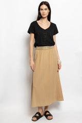 Sand gauze cotton midi skirt with gold elastic waistband and soft A-line drape – Sydney French fashion by Volange Paris.