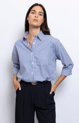 Blue and white striped shirt relaxed silhouette and chest pocket, effortless Parisian style – French fashion by Volange Paris.