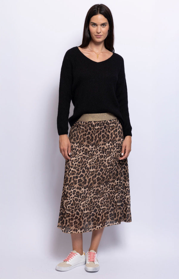 Flattering midi skirt with a bold leo print, made from lightweight polyester, gold elastic waist band offering a feminine silhouette – Parisian fashion Volange Paris.