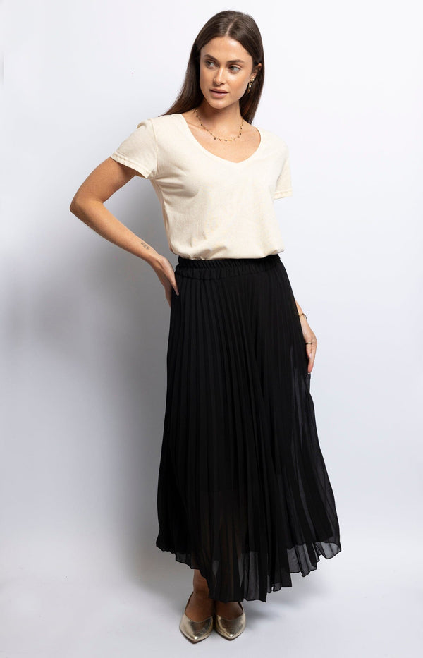 Black pleated skirt with a flowy silhouette – Elegant French fashion piece from Volange Paris
