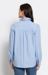 Sky blue cotton blouse with an elegant ruffle collar and relaxed silhouette for effortless everyday style – Volange Paris, Parisian fashion in Sydney (Mosman, Paddington and Bronte) or Australia-wide online.