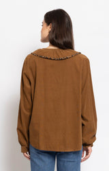 Soft tan blouse with romantic ruffle detailing and subtle leopard trim for an elegant Parisian-inspired look – Volange Paris, Parisian fashion in Sydney (Mosman, Paddington and Bronte) or Australia-wide online.
