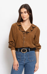Soft tan blouse with romantic ruffle detailing and subtle leopard trim for an elegant Parisian-inspired look – Volange Paris, Parisian fashion in Sydney (Mosman, Paddington and Bronte) or Australia-wide online.