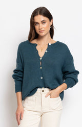 Soft teal cardigan in a cosy fluffy knit with a relaxed silhouette and delicate button-front detail – Volange Paris, Parisian fashion in Sydney (Mosman, Paddington and Bronte) or Australia-wide online.