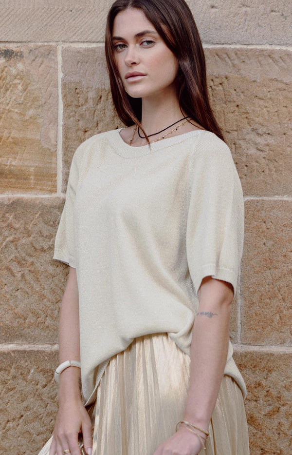 Gold shimmer knit top with round neck, short sleeves, and relaxed fit – Luxurious touch by Volange French Fashion.