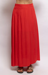 Vibrant red maxi skirt in lightweight viscose with a flowing shape, fitted waistband and elegant side split – Volange Paris, Parisian fashion in Sydney (Mosman, Paddington and Bronte) or Australia-wide online.