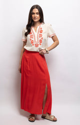 Vibrant red maxi skirt in lightweight viscose with a flowing shape, fitted waistband and elegant side split – Volange Paris, Parisian fashion in Sydney (Mosman, Paddington and Bronte) or Australia-wide online.