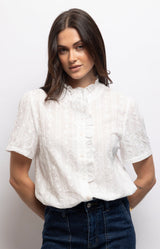 White cotton blouse with delicate floral embroidery, ruffled stand-up collar and feminine frill detailing – Volange Paris, Parisian fashion in Sydney (Mosman, Paddington and Bronte) or Australia-wide online.