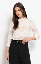 White lace cotton blouse with delicate pearl embellishments, intricate openwork detailing and a romantic frilled neckline – Volange Paris, Parisian fashion in Sydney (Mosman, Paddington and Bronte) or Australia-wide online.