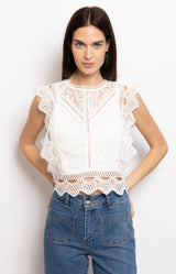 White lace sleeveless top with scalloped edges and a cropped fit – Wardrobe essential French fashion by Volange Paris.