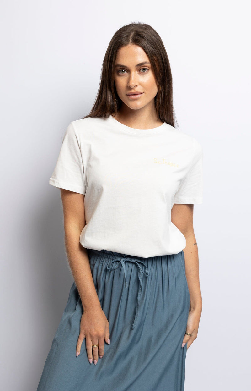 Soft white cotton crewneck T-shirt with gold St. Tropez embroidery on front and back – Relaxed French coastal style by Volange Paris.