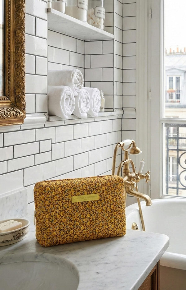 Block Print Yellow floral cotton toiletry bag with padded structure and zip closure – Parisian travel essential by Volange Paris.
